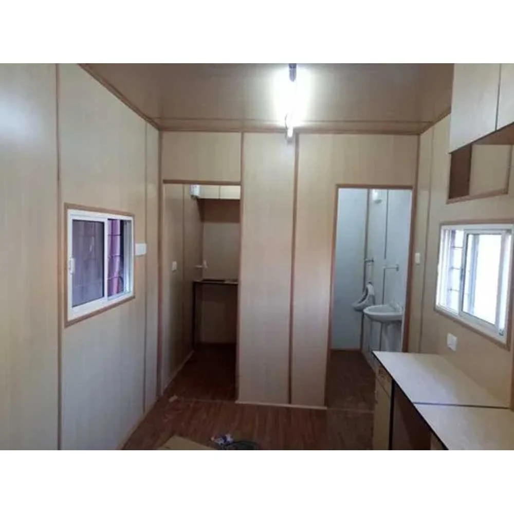 An interior view of a prefab container homes that includes both a kitchen and a bathroom, highlighting efficient use of space - office and dry containers