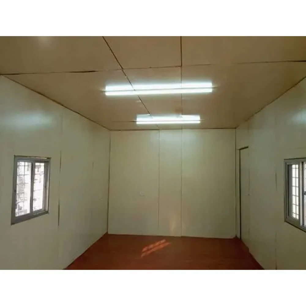 A shipping container homes with white walls and a window, contributing to a fresh and bright ambiance - office and dry containers
