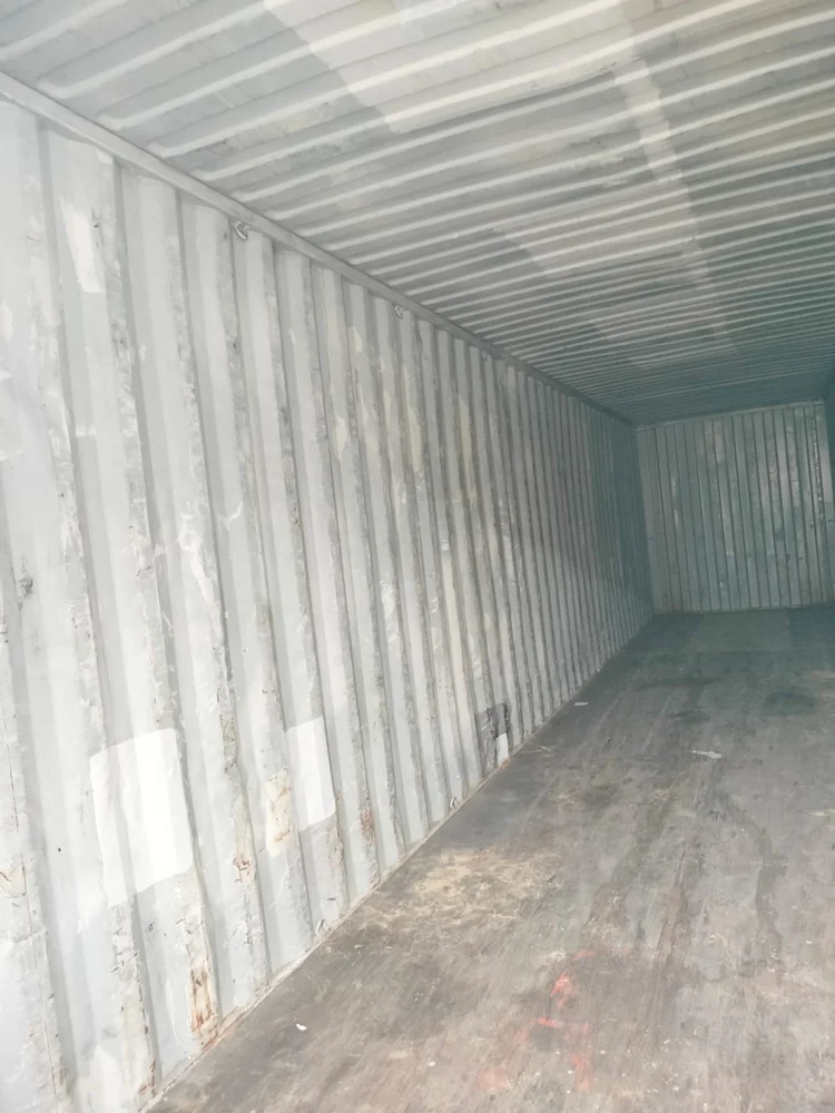 Open door of a large dry containers, 40 feet industrial containers showcasing the empty interior space, emphasizing its size and accessibility - office and dry containers