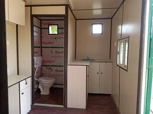 A compact bathroom featuring a toilet and sink in portable container homes , designed for efficient use of space in a small room - office and dry containers
