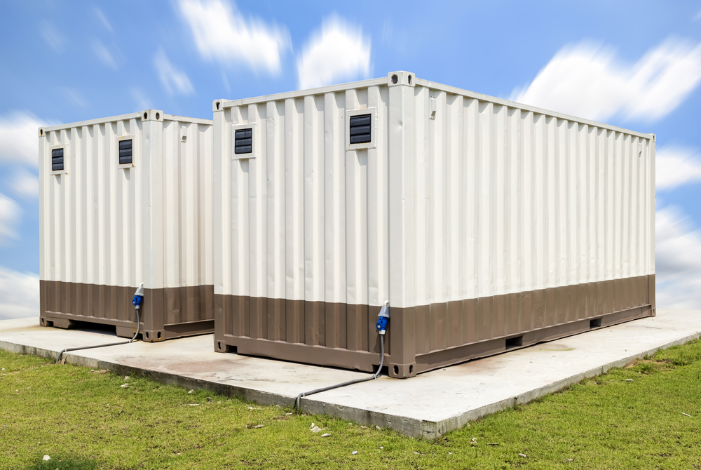 A portable office containers featuring orange and white walls complemented by elegant wooden flooring, creating a warm and inviting atmosphere - office and dry containers